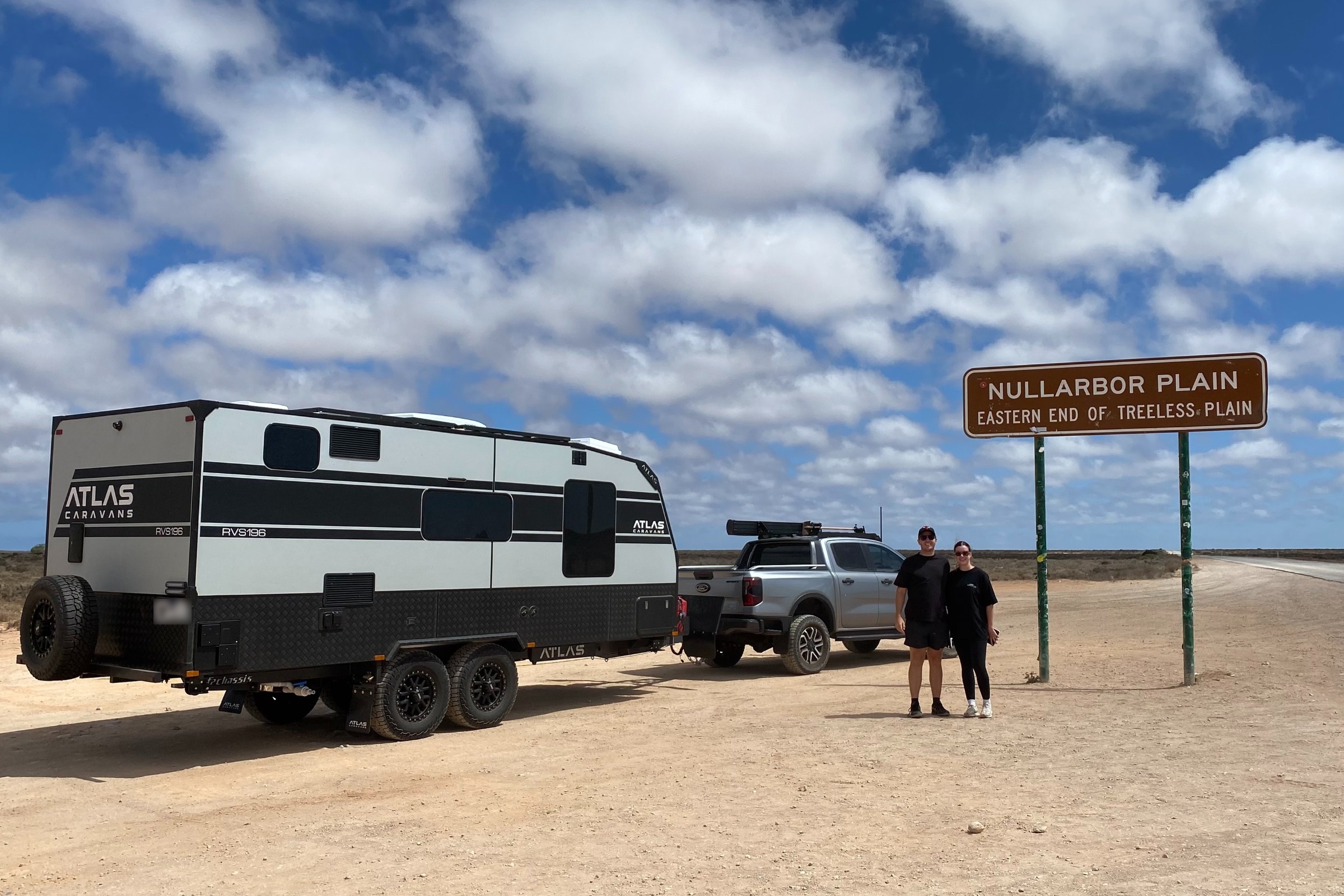 Caravan parked at the 90 Mile Straight sign